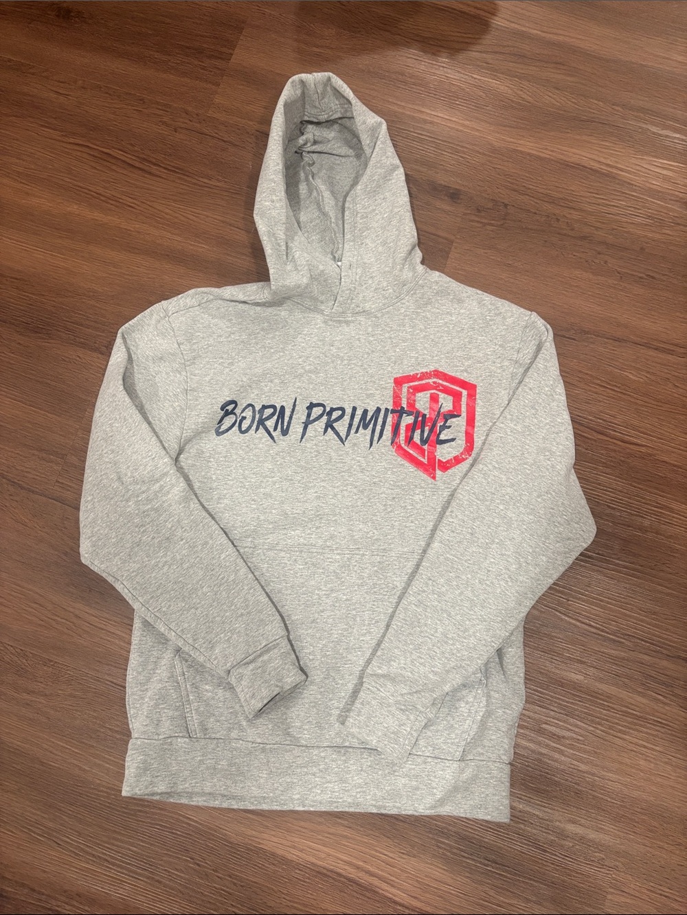 Born Primitive Light Gray Hoodie with Navy Script and Red Shield